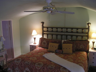 [The bedroom; this room has the television, viewable from the bed]