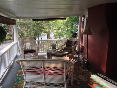 [Nothing like a private porch to spend a late summer afternoon (yes, I know it's technically autumn right now). You wish you were here.]