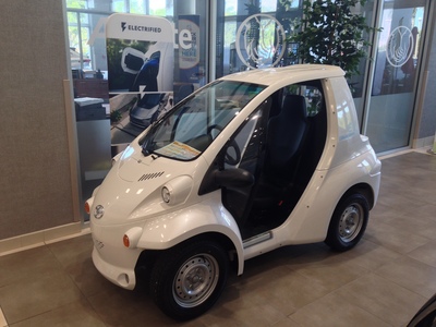 [A very small electric car for one] That's not a car!  That's an oversized roller skate!
