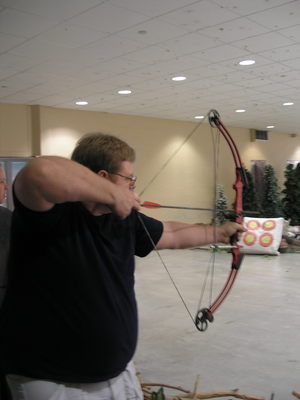 [The groom-to-be taking aim]