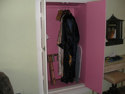 [Complimentary bathrobes in the pinkest closet I've ever seen]