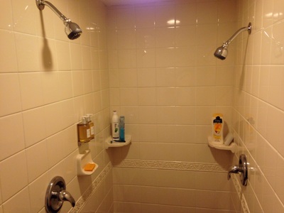 [His-n-hers shower heads. How sweet!]