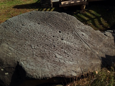 [It's hard to make out the petroglyphs due to erosion but they're there, all 100 or so.]