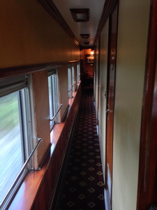 [Three staterooms to the right, and the dining room at the far end.  There's quite a bit packed into a 74′ train car.]