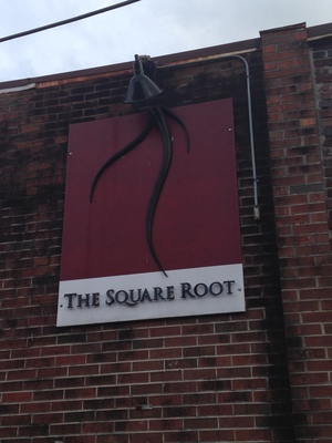 [I think they wanted to call the place 1.732050807568877, but that was just too long to use on a sign.  Also, those roots aren't square.]