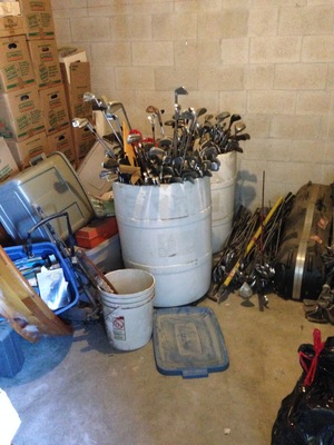 [A barrel full of golf clubs—what fun!]