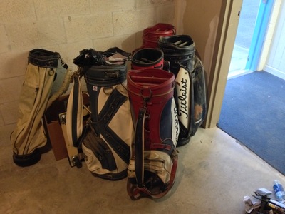 [Empty golf bags.  We do have enough to open up a store, don't we?  Thank God that's the last of it.  Sheesh!]