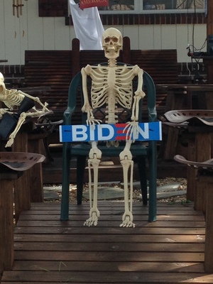 [A skeleton holding a BIDEN sign—yeah, I guess he has a few bones to pick with Biden.]