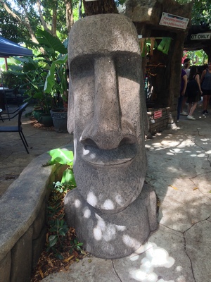 [A human-sized statue of an Easter Island moai.] “What?  You expect me to say something like ‘Ooom poppa chikamaga wana sing gow / Do lomma sinnigama mana ching jow / Inimana choogamaga wana sing gee / Finimana foonimana one is now free?’  Wrong culture dude!”