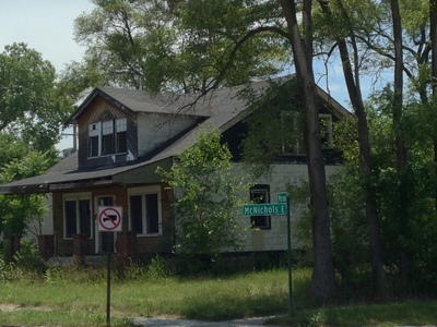 [A two story house, long since abandoned, sans windows, in downtown Detroit] There's a great cross-breeze through the house.