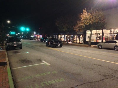 [A car that is parked in the middle of Main St.] In the actual rules of Monopoly, there is no monetary reward for landing on Free Parking.