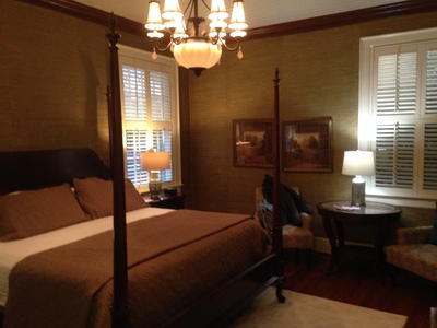 [Image of the main room in our suite, a large four-post bed taking up most of the view] That bed is easily four feet (1.3m) in high!  That's a serious bed!