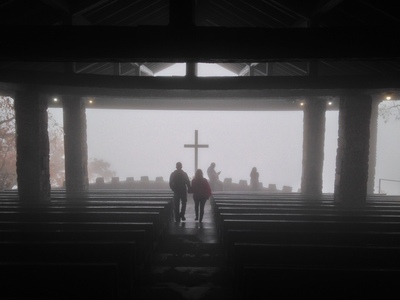 [The pews, the Cross, and the expansive moutain view swallowed up in white.] I figured there'd be more harp playing than there was.  As it was, it was quiet.  And unearlthly.  Wow!