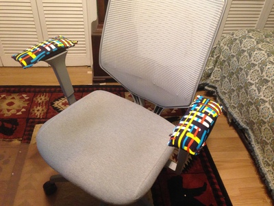 [Picture of a chair with arms, now with the new arm covers.] Is it not nifty?